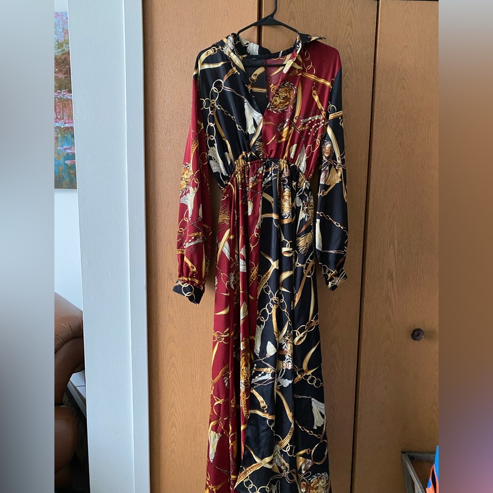 This is a long sleeve black/red dress. It’s silky with a slit down the middle.